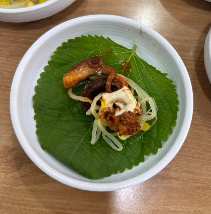 Jjukkumi served in a perilla-leaf wrap