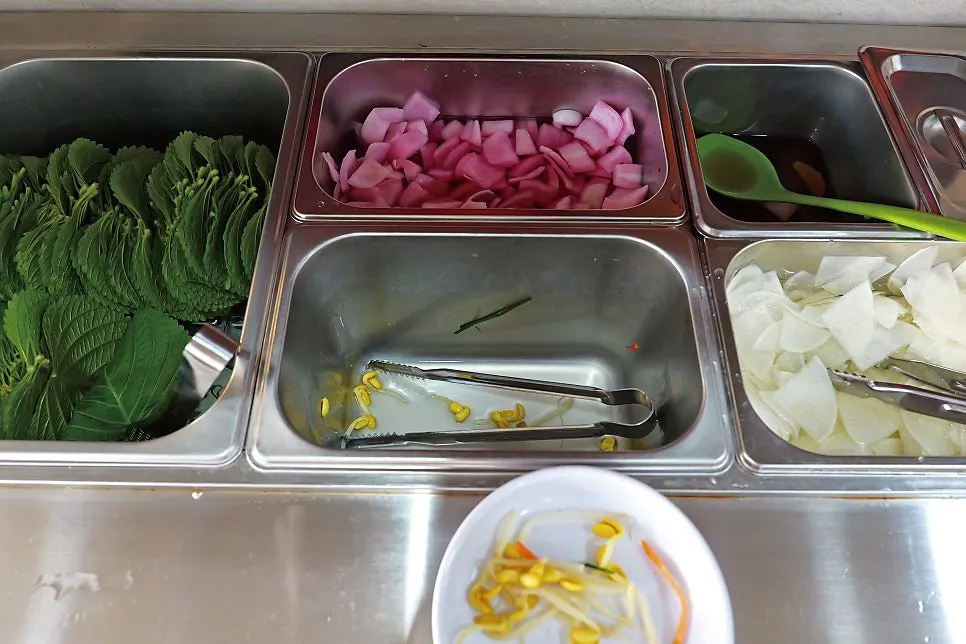Various banchan laid out at the self-serve bar