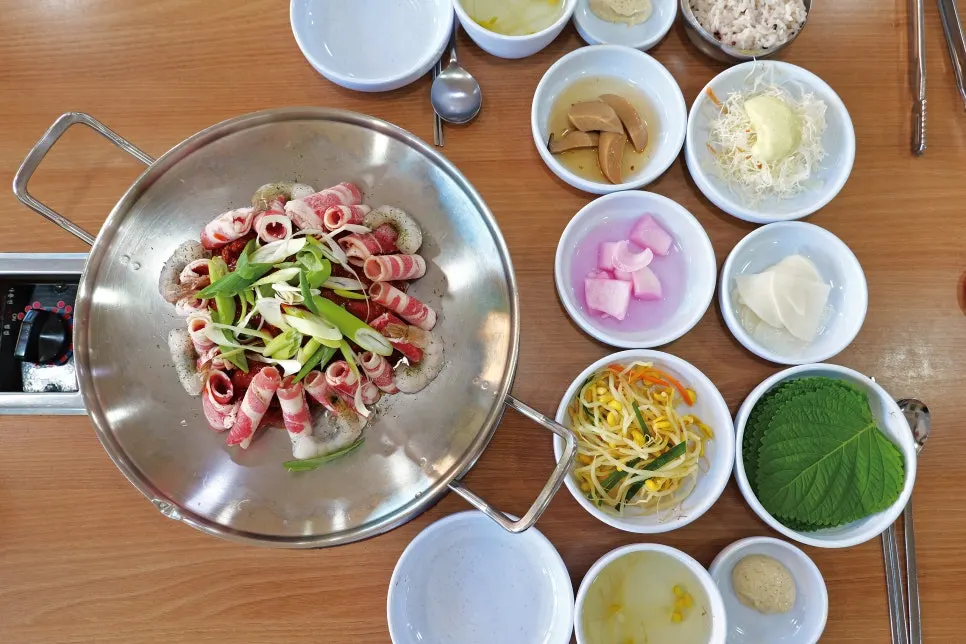 Hwasae with beef belly and shrimp layered over the octopus