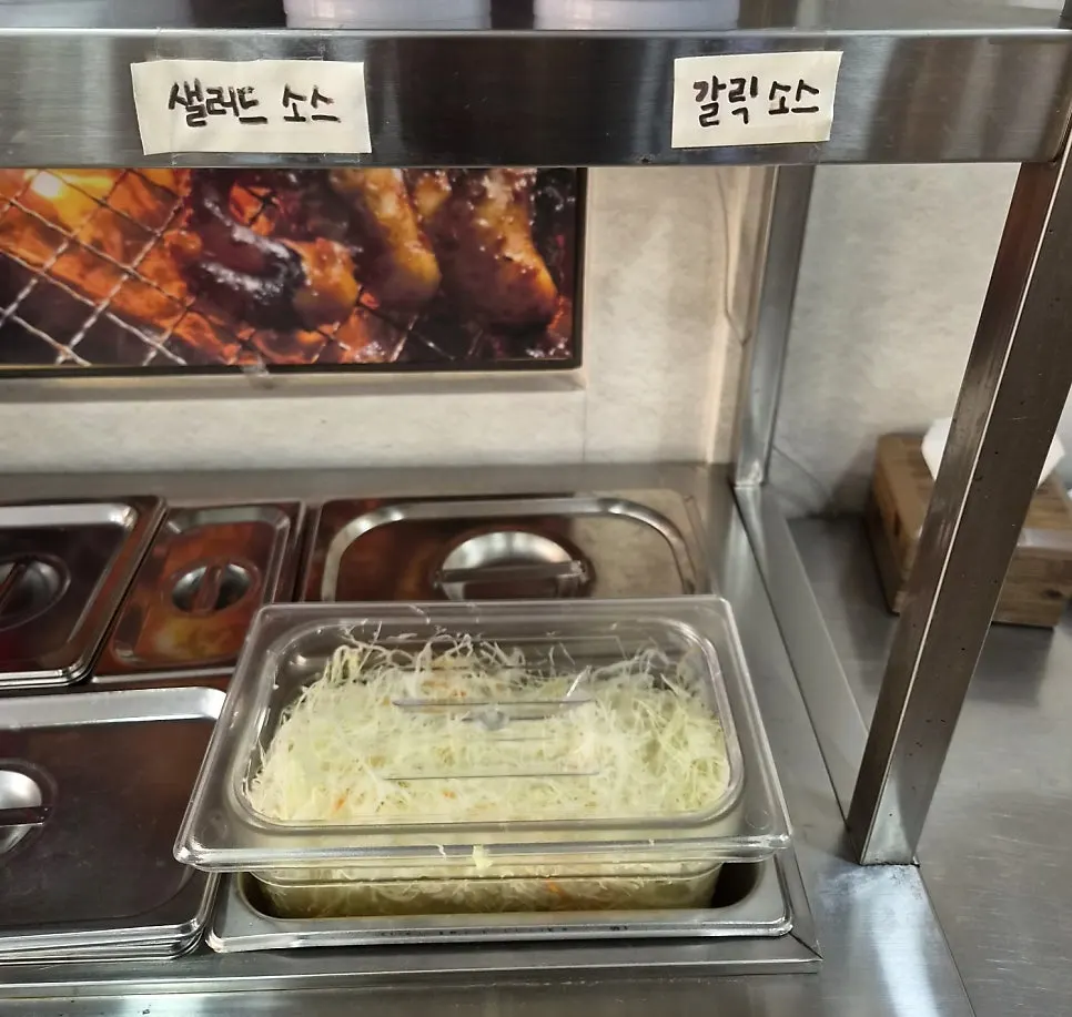 Salad and garlic sauce at the self-serve bar