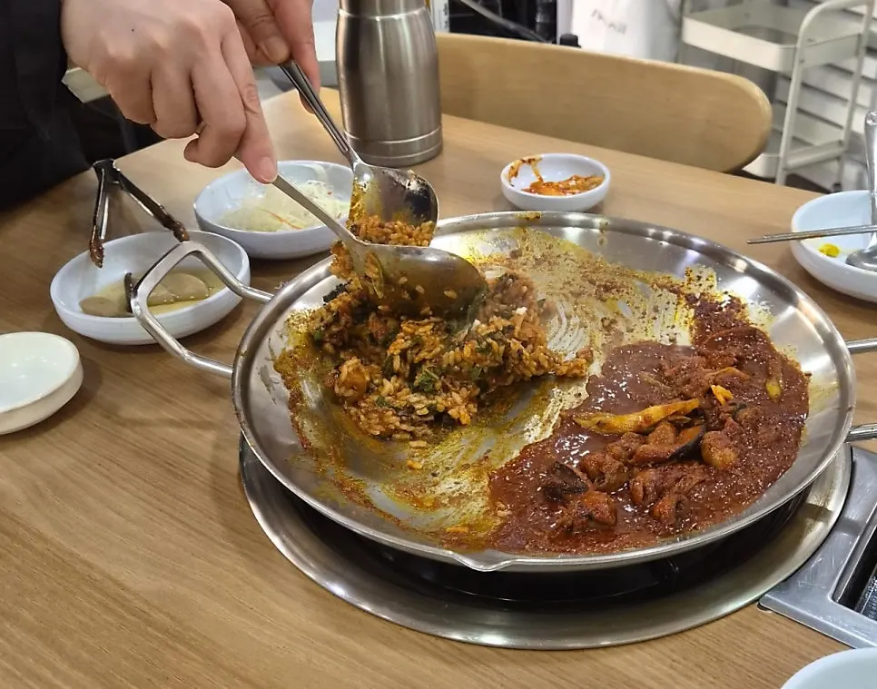 Owner stir-frying the cheese fried rice