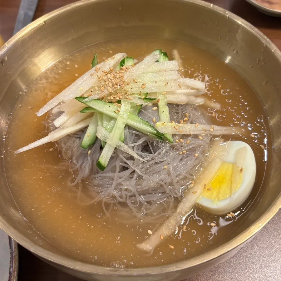 Bowl of doenjang jjigae with crab and zucchini