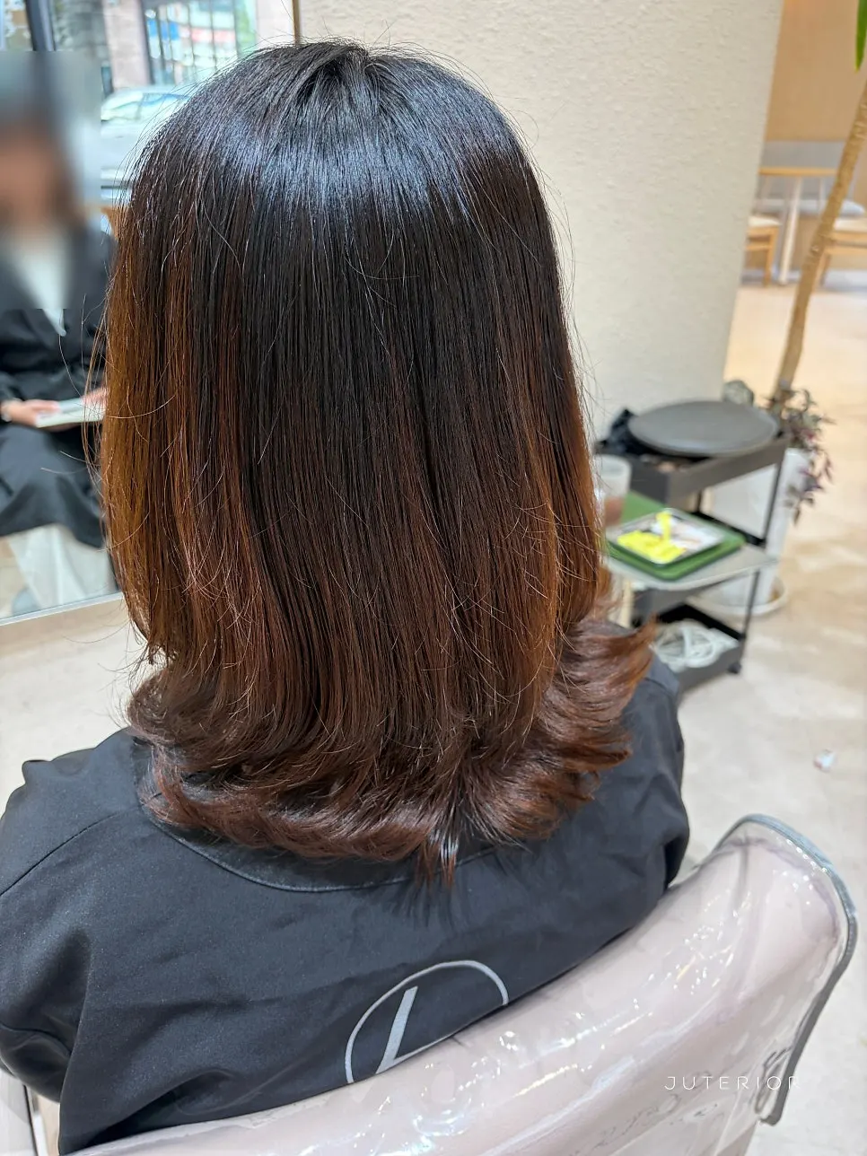 Awkward grow-out hair tidied with a C-curl perm