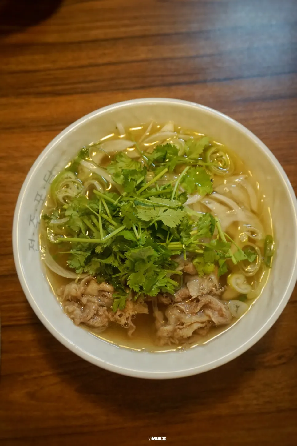 Phodam brisket beef pho topped with cilantro