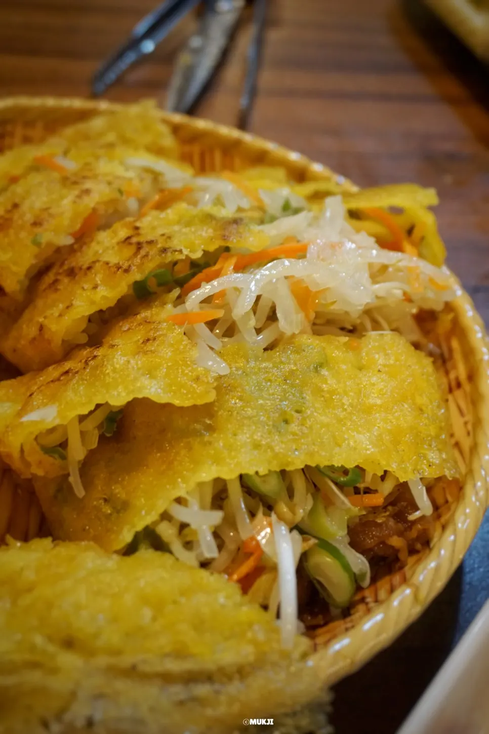 Pieces of banh xeo cut with scissors