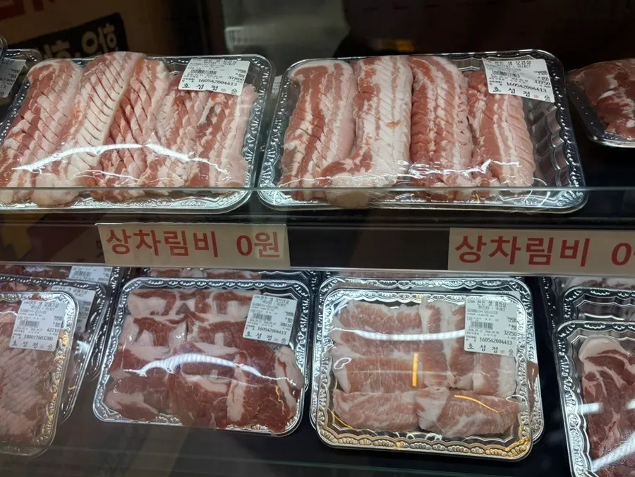 Pork platter packs in the meat display case