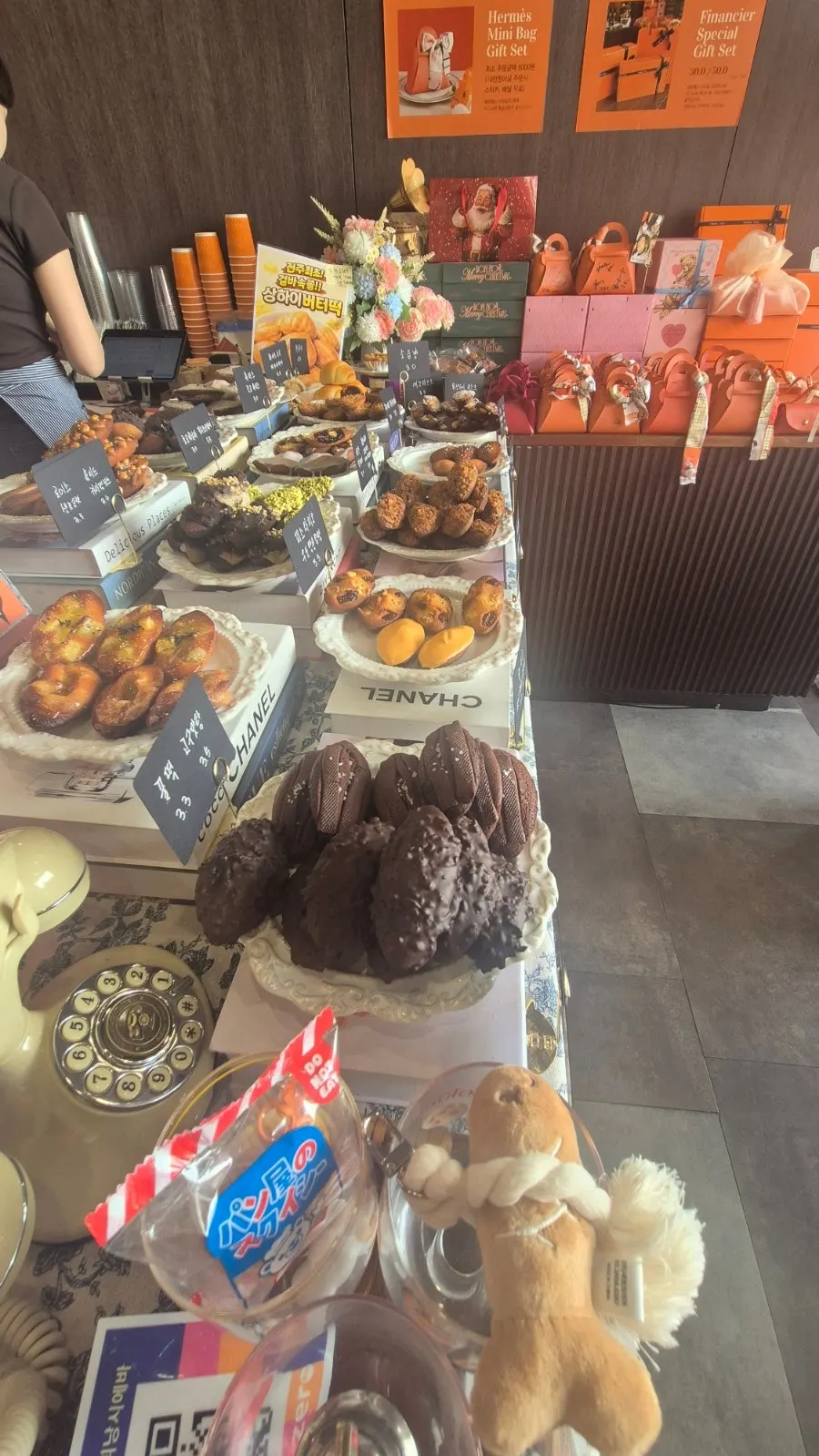 Various kinds of financiers displayed on shelves