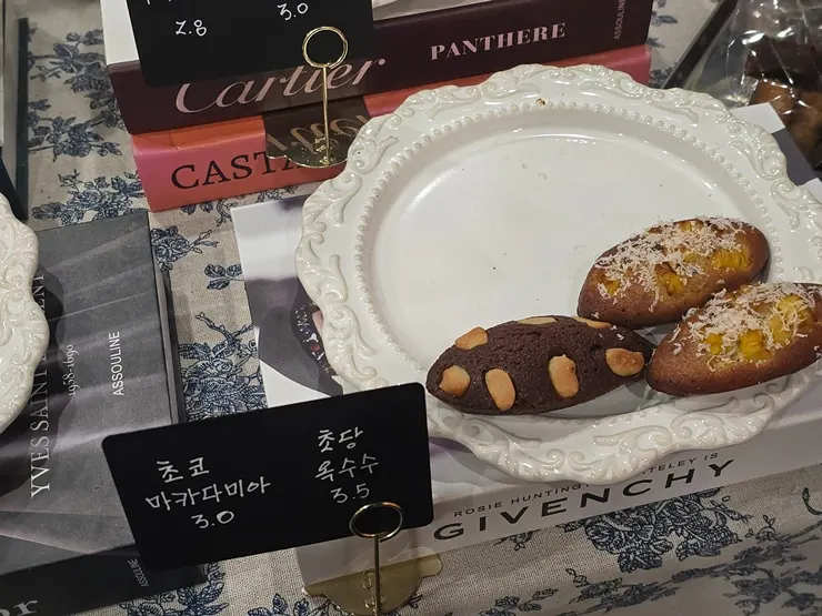 Choco macadamia and corn financiers on display