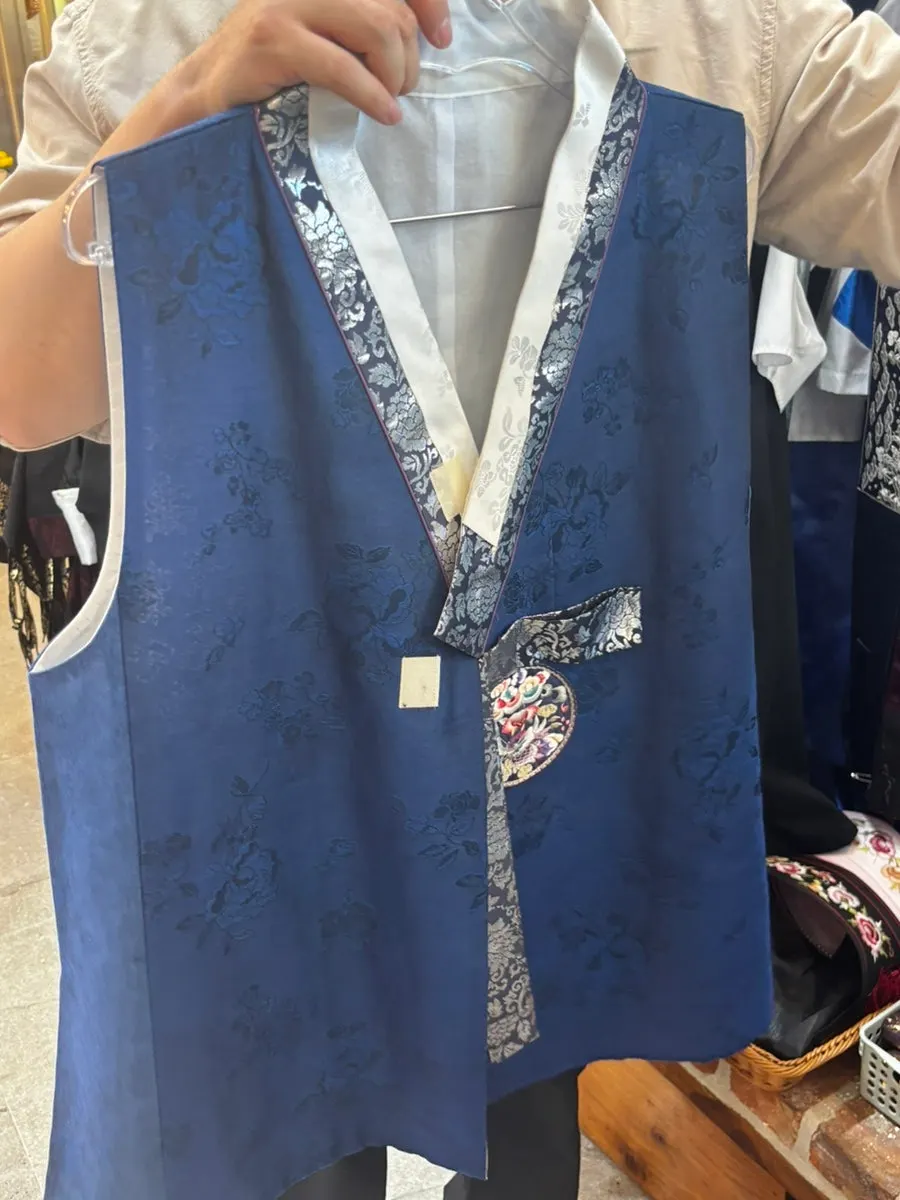 Trying on men's hanbok to choose a style