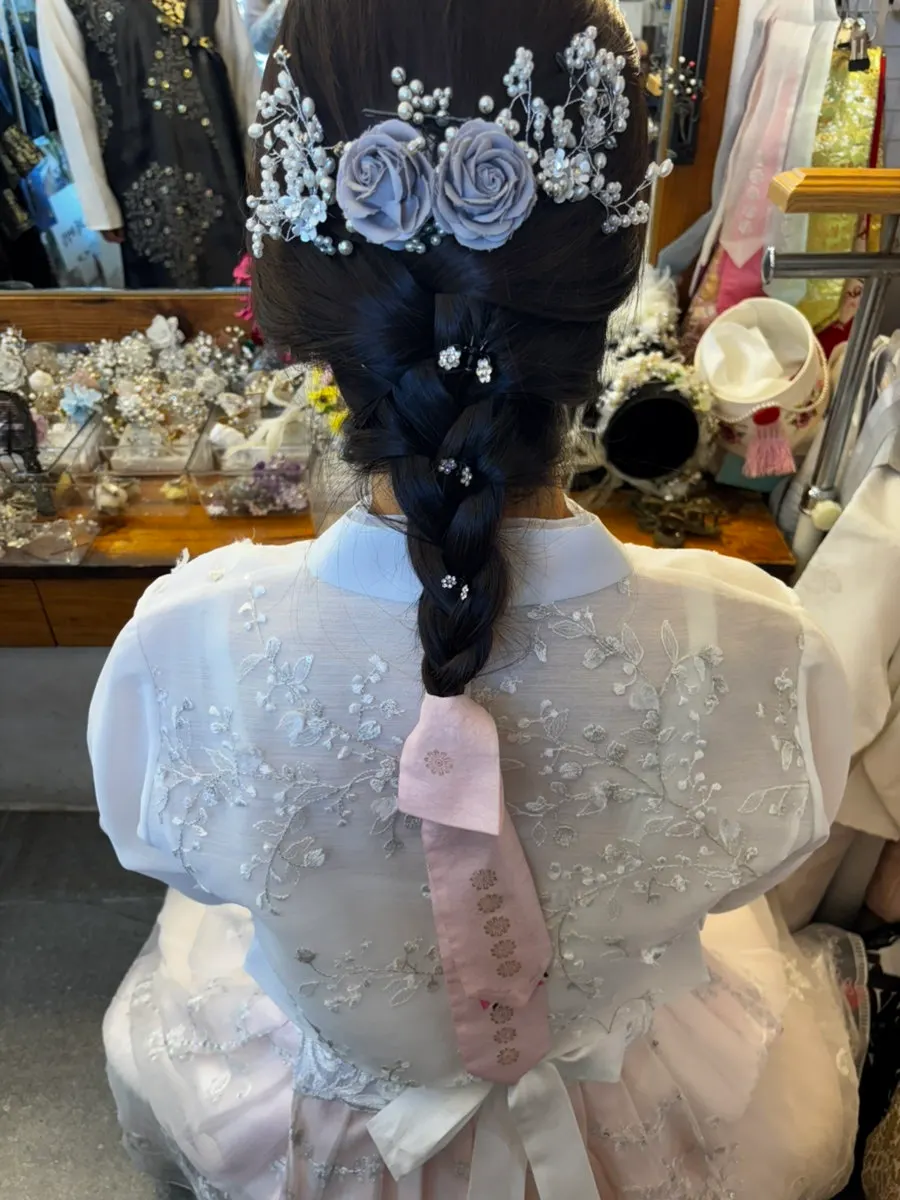 Back view of braided daenggi hairstyle with accessories