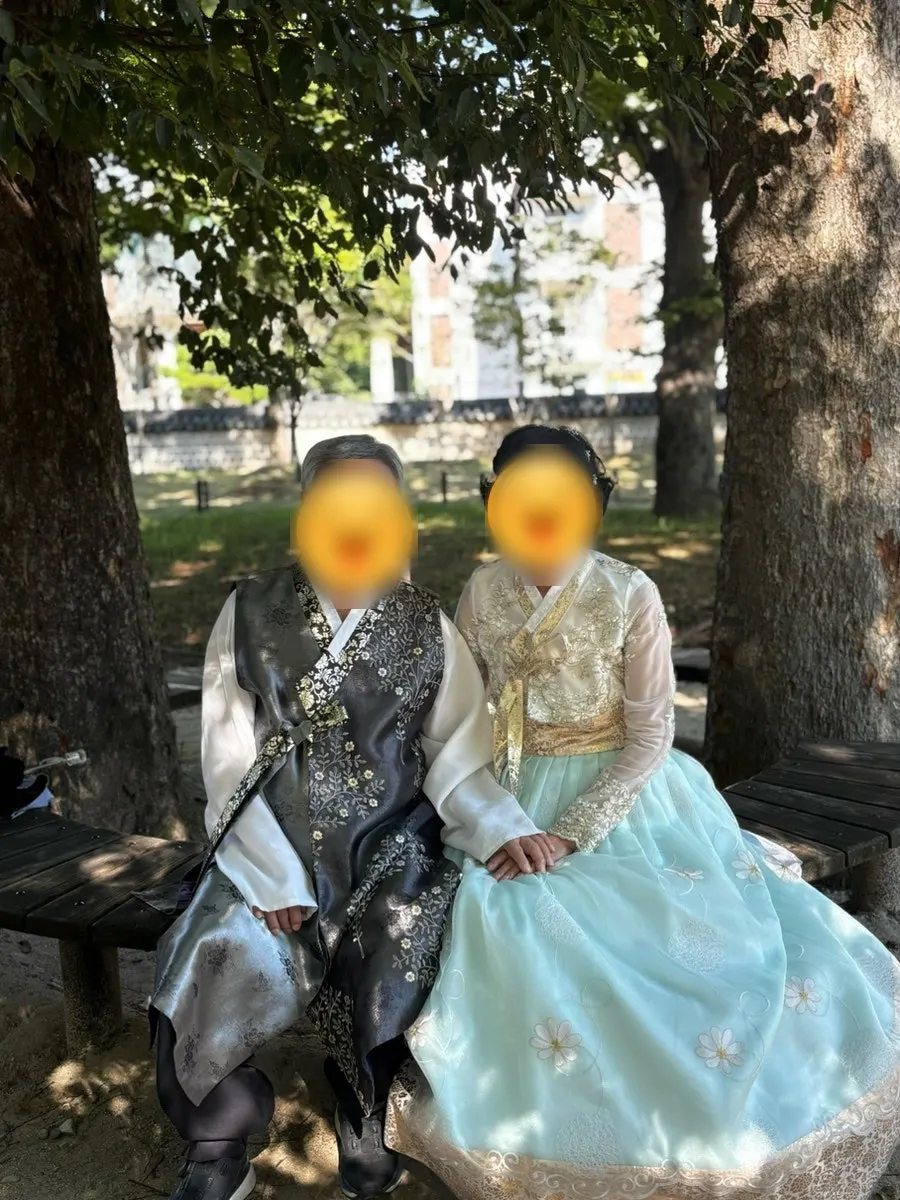 Family photo in hanbok taken at Gyeonggijeon