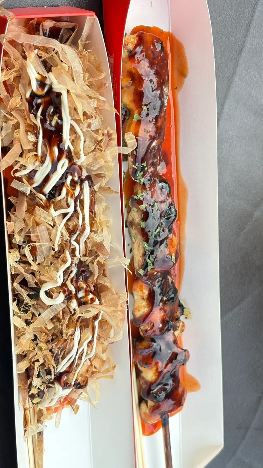 Freshly cooked chicken and octopus skewers