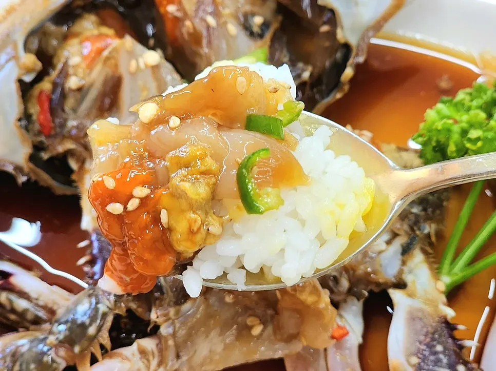 Crab meat piled on rice topped with a soft-boiled egg