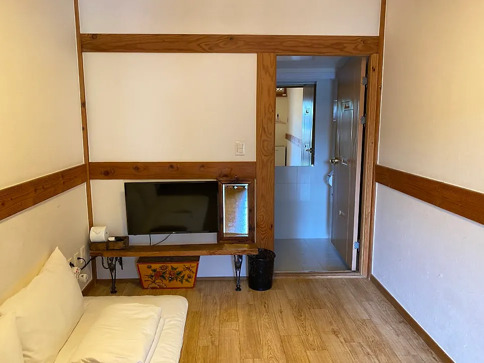 Hanok stay with tiled roof and courtyard in view