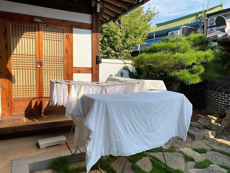 Sunny day view of the hanok stay's courtyard