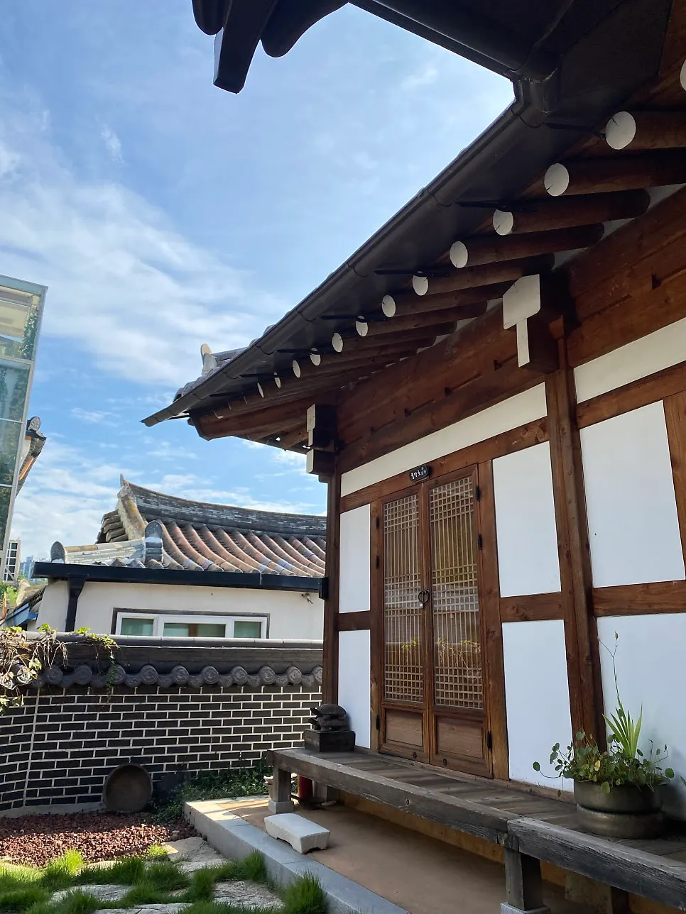 Hanok courtyard with towels and blankets drying