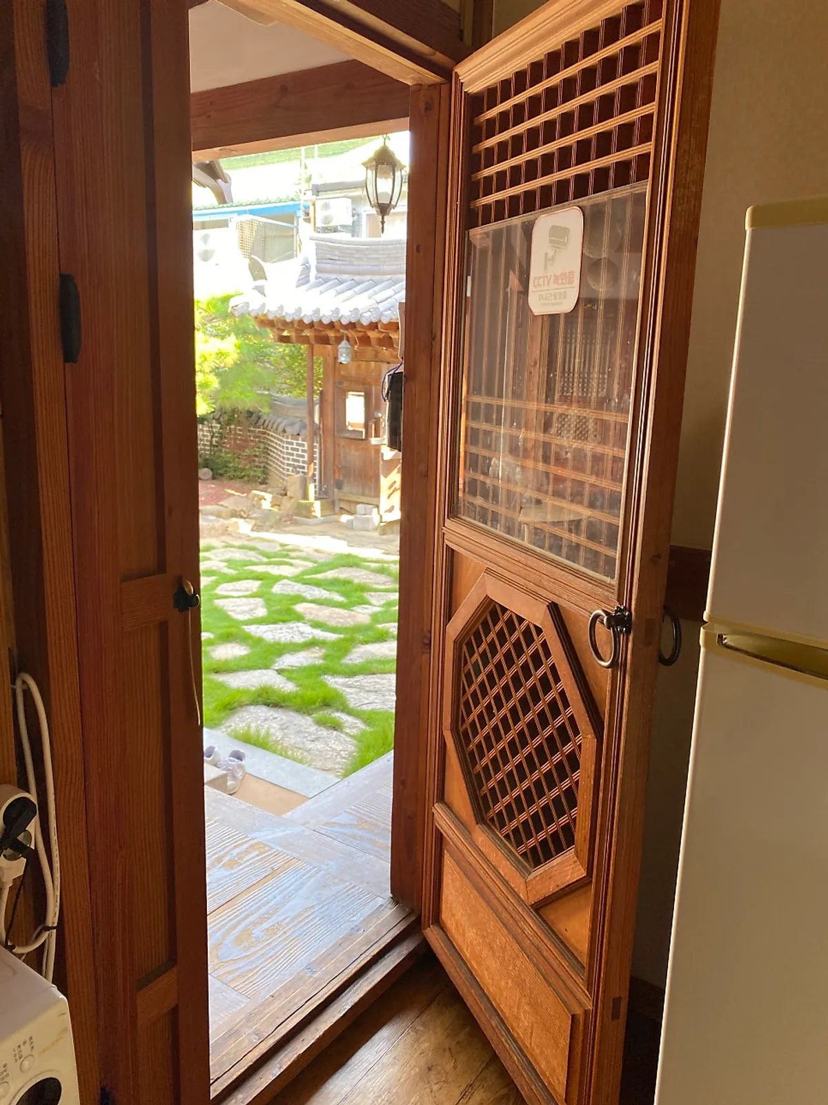 Shared hanok kitchen with coffee, tea, and water purifier