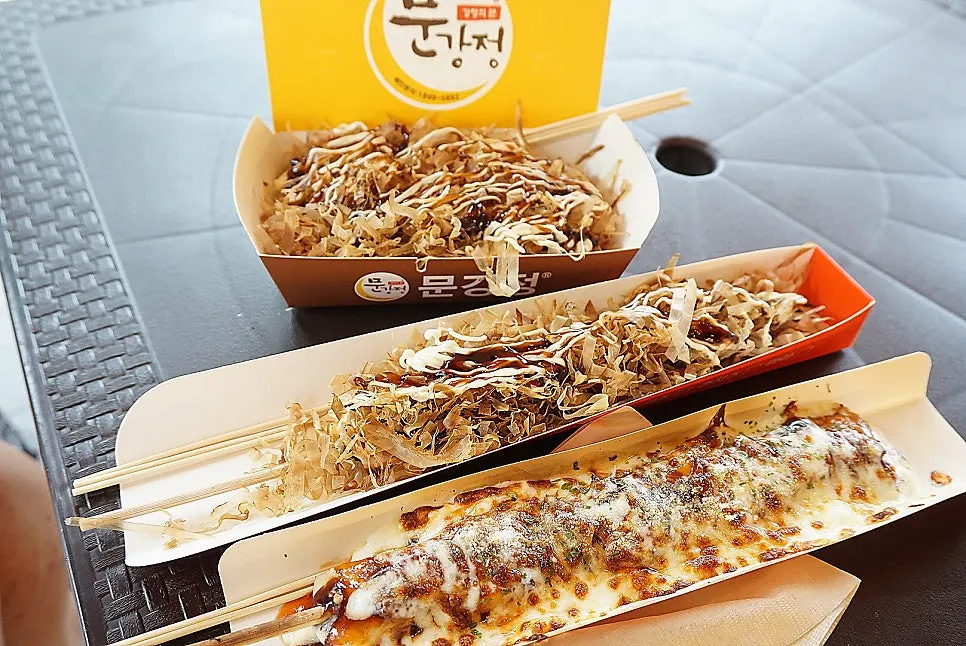 Octopus dish topped generously with sauce and bonito flakes
