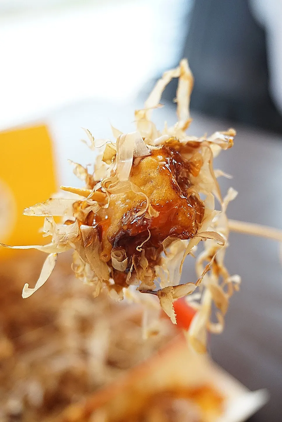 Katsuo mungangjeong topped with bonito flakes and sauce