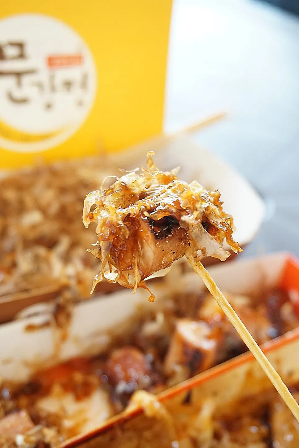 Octopus skewer pulled off the stick and dipped in sauce