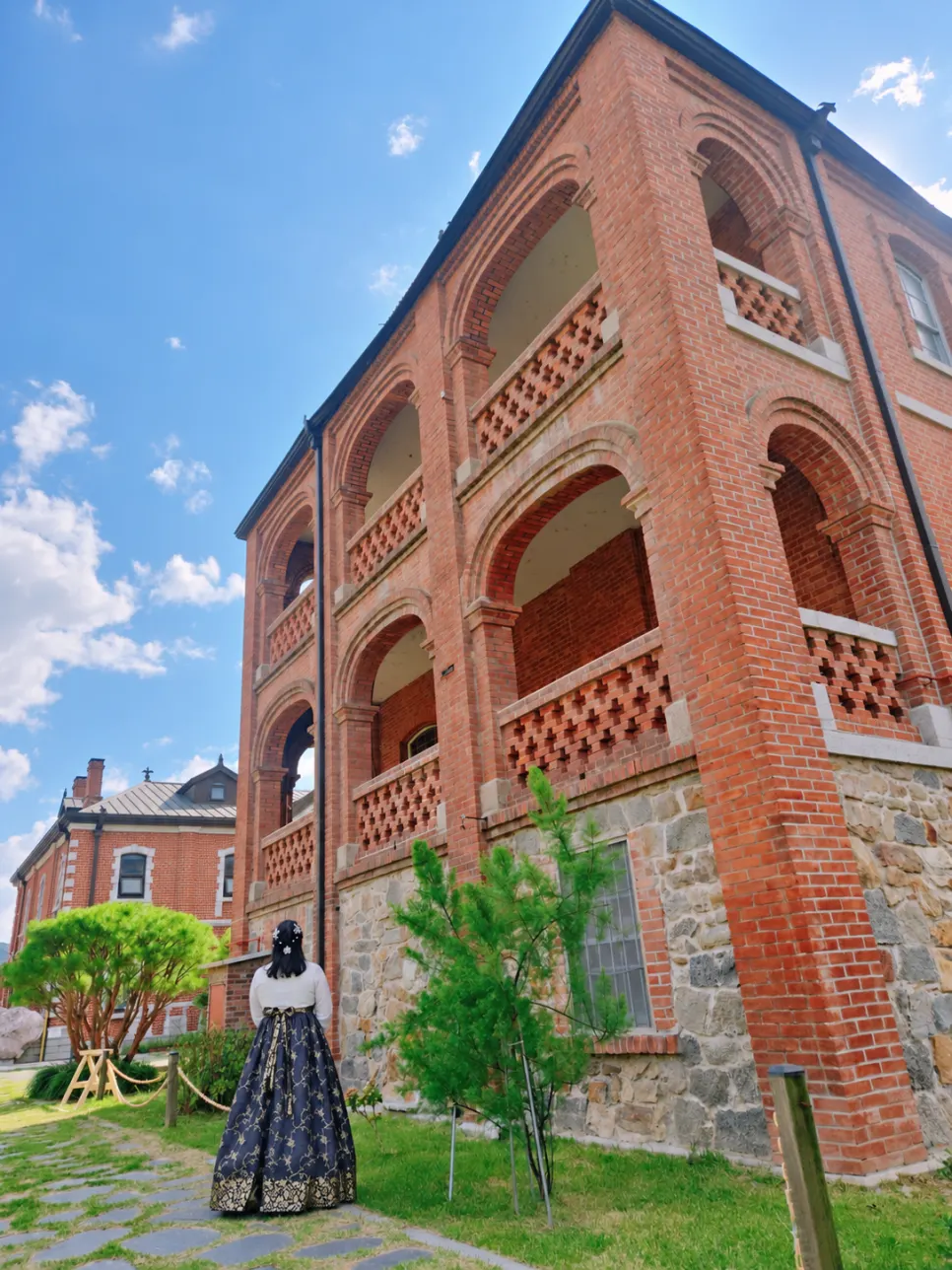 Walking the stone-walled streets of Jeonju Hanok Village in hanbok