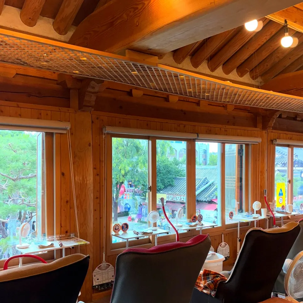 Inside the café, where the wooden structure of a hanok is visible