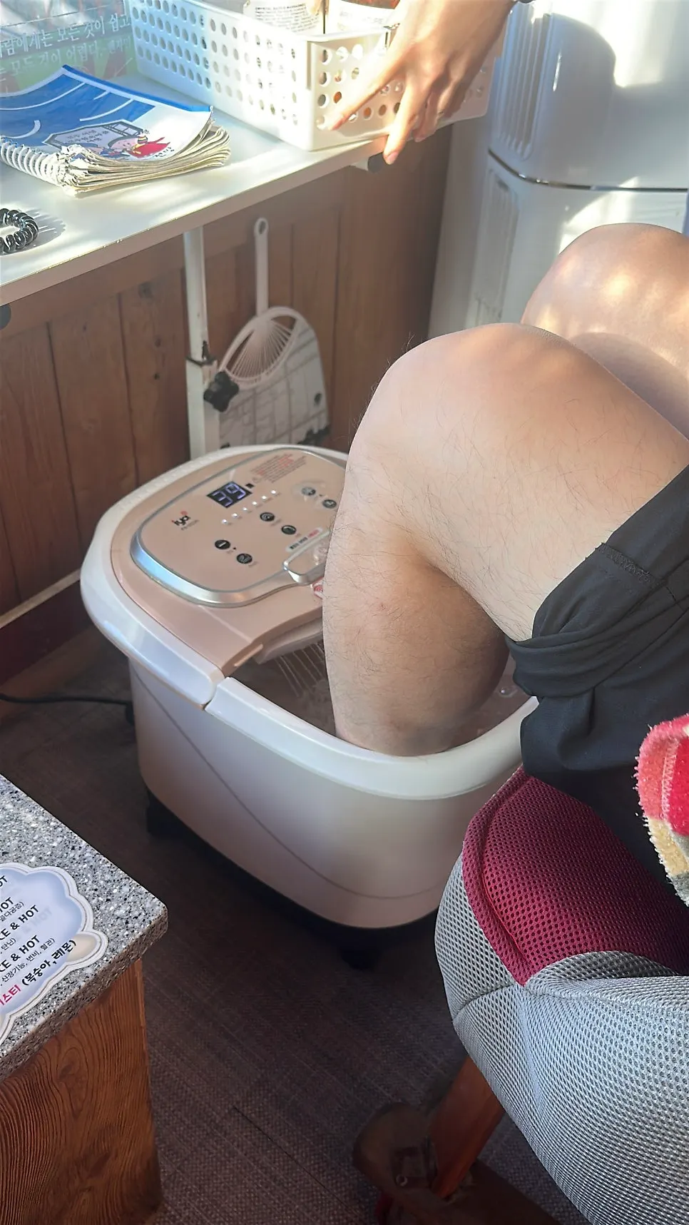 Feet soaking in the herb-scented foot bath
