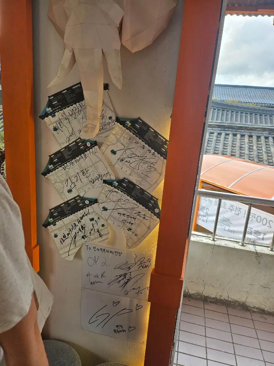 Autographs from visiting celebrities on the café wall