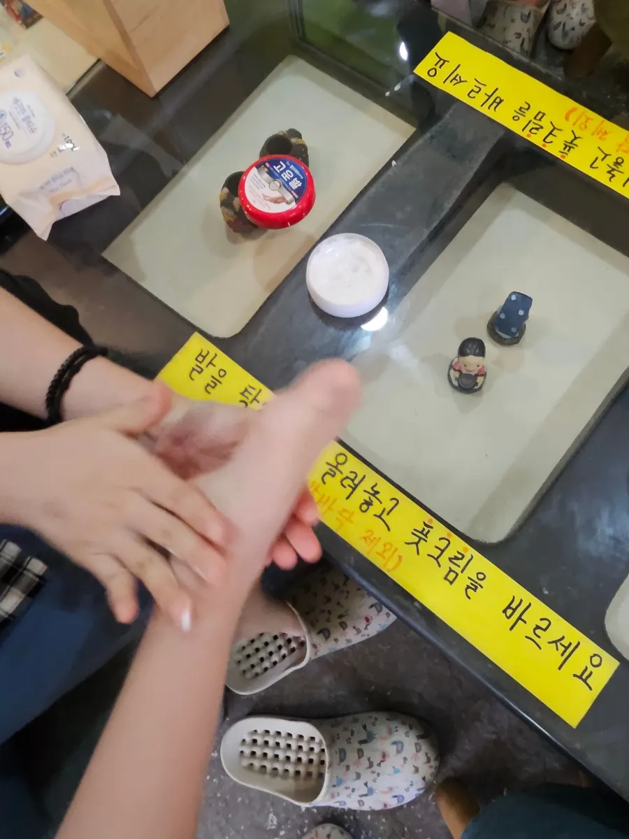 Foot cream application area set up near the entrance