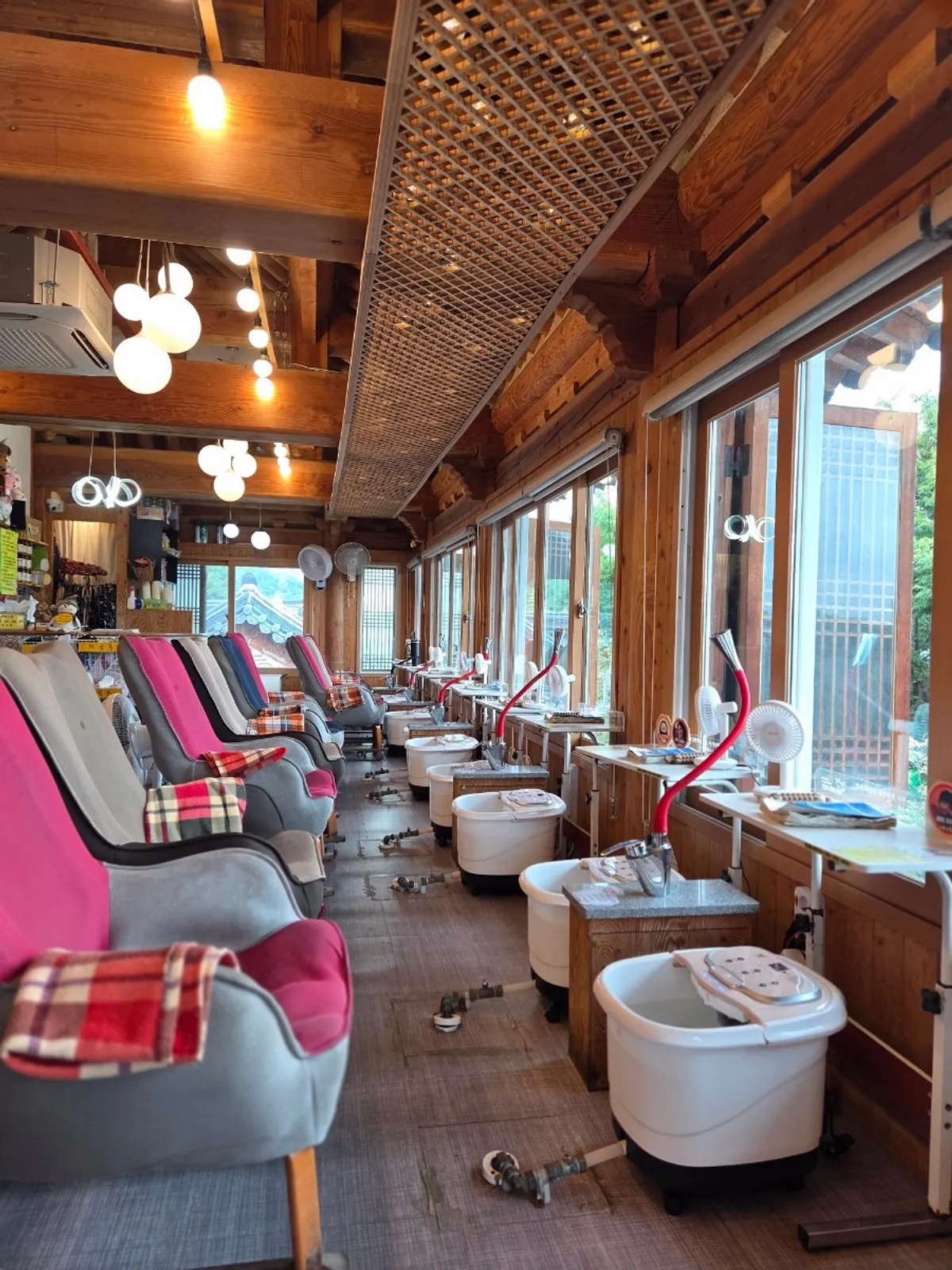 Foot bath seats facing the window with wood interior