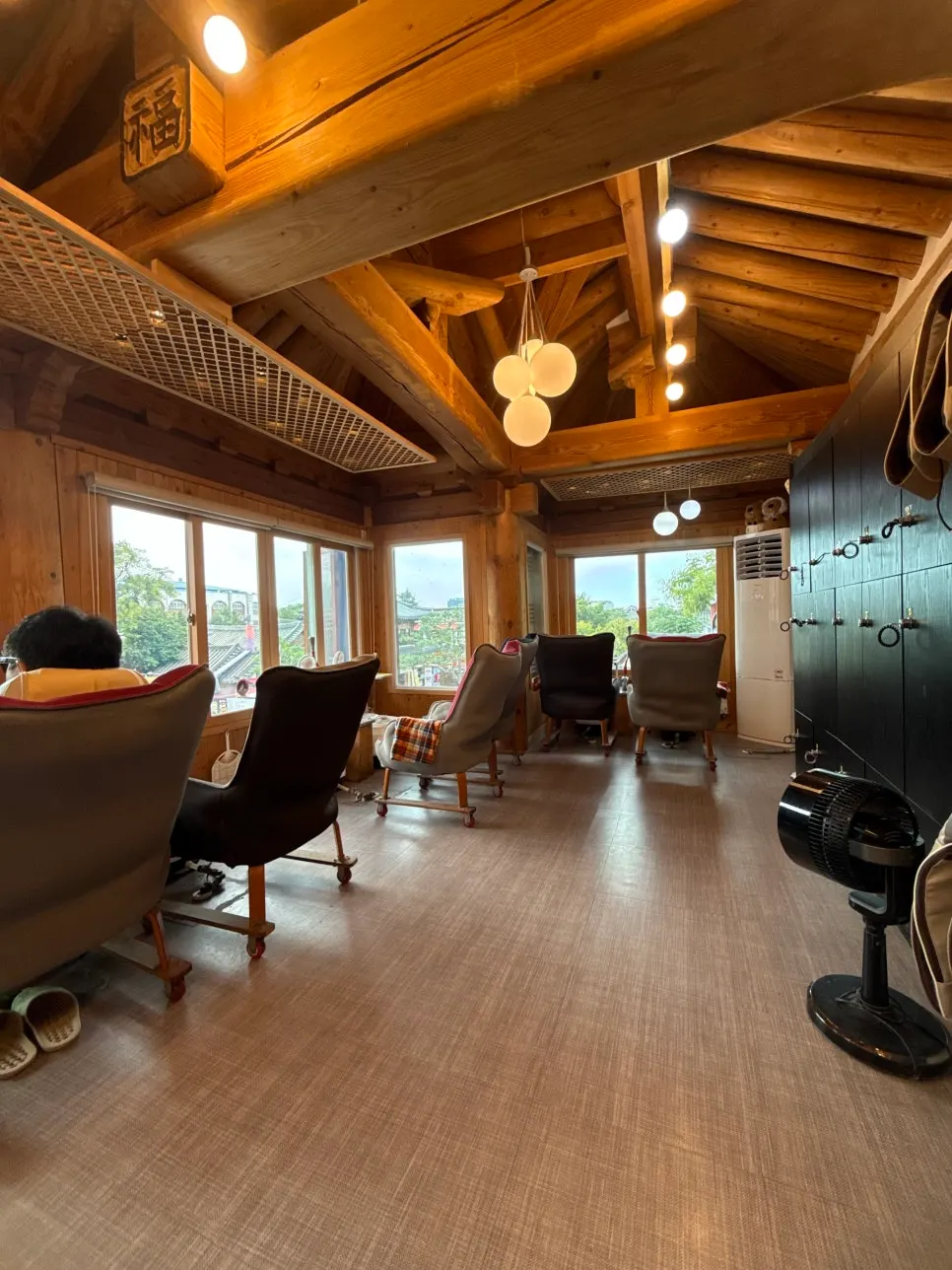 Interior of the foot bath cafe with soft lighting and large windows