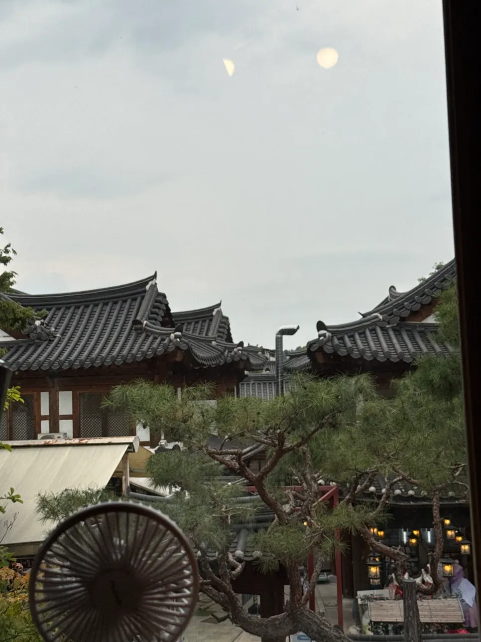 View of the hanok village tiled roofs through the window