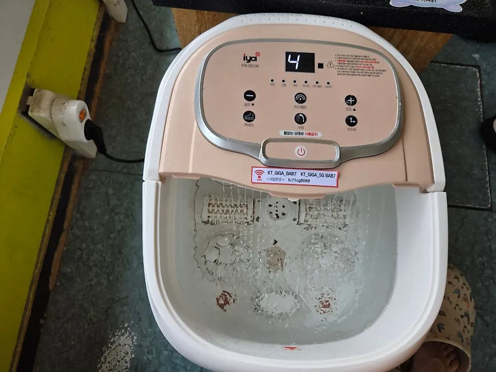 Feet soaking in warm water for a foot bath
