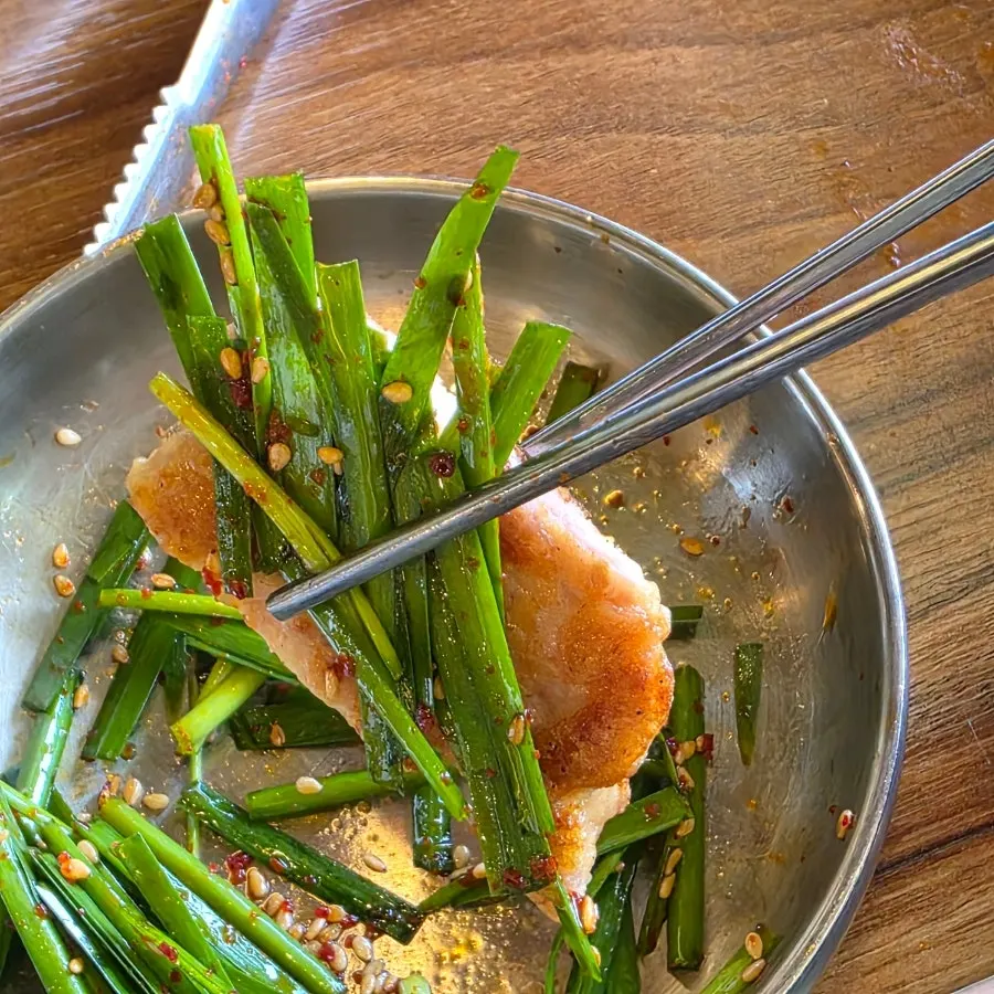 Yukjeon served with seasoned chives