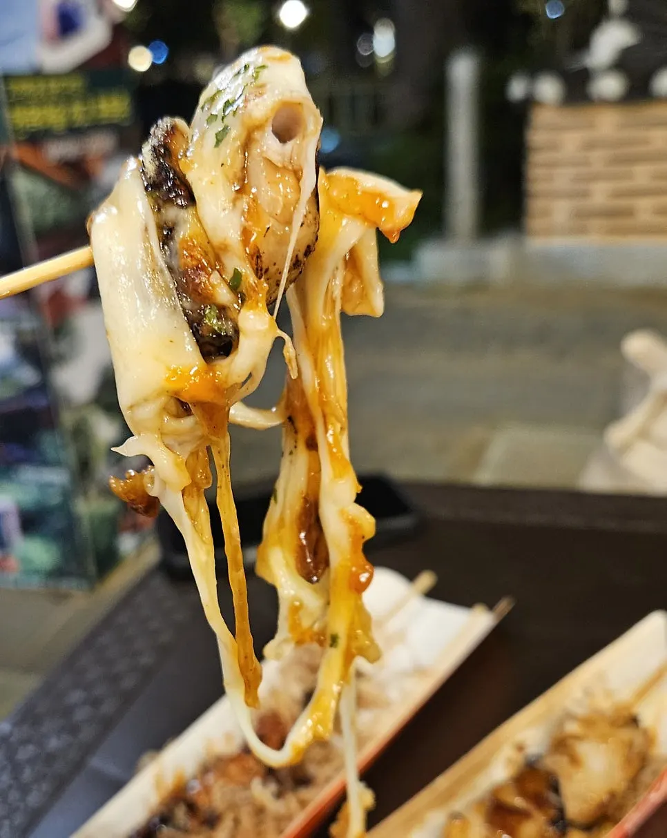 Cheese chicken skewer coated in sauce