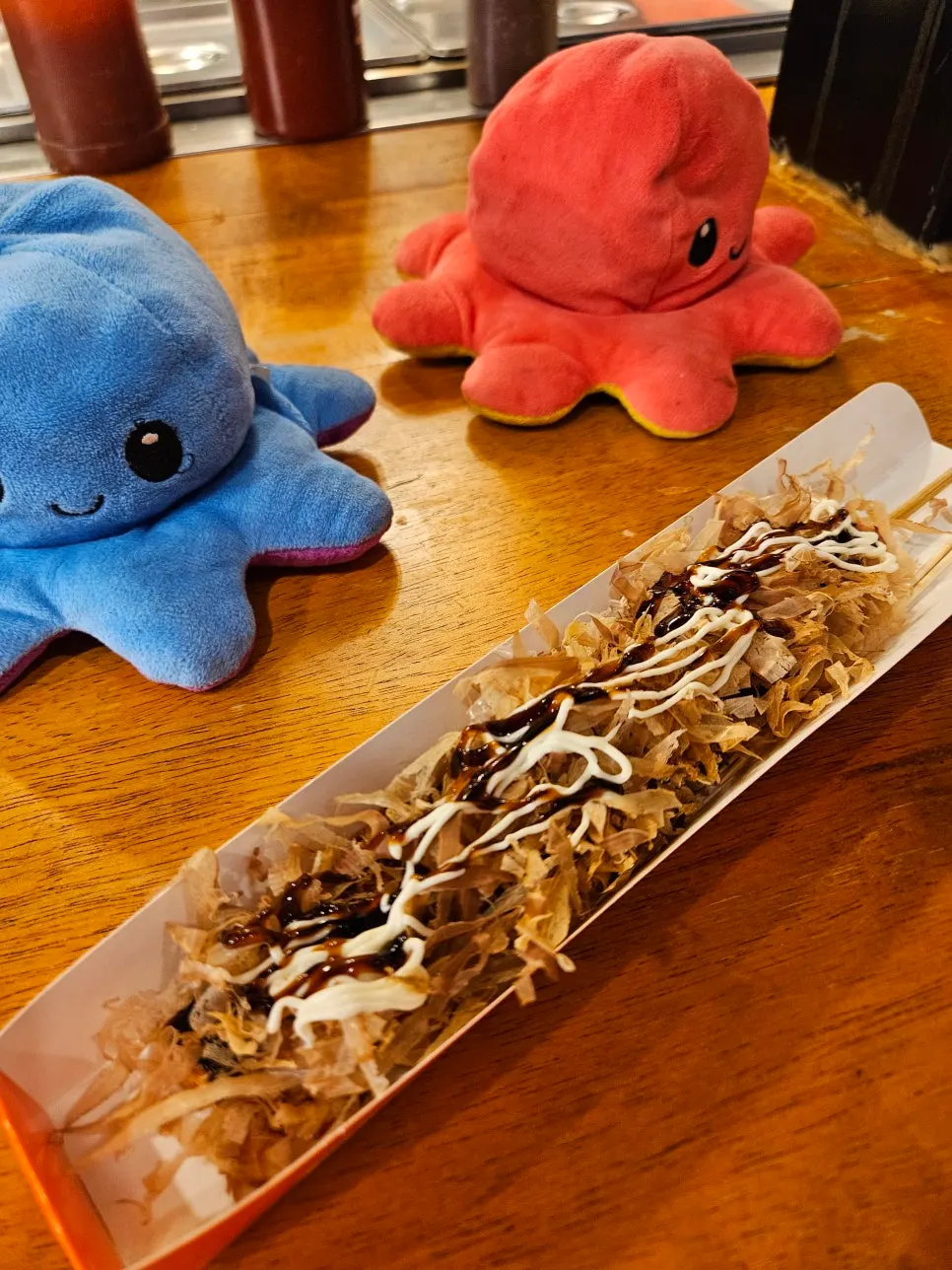 Katsuobushi octopus skewer topped with bonito flakes