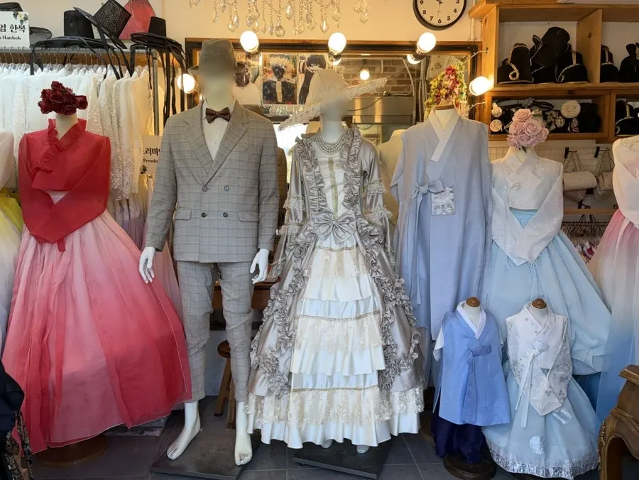 The shop entrance lined with hanging hanbok