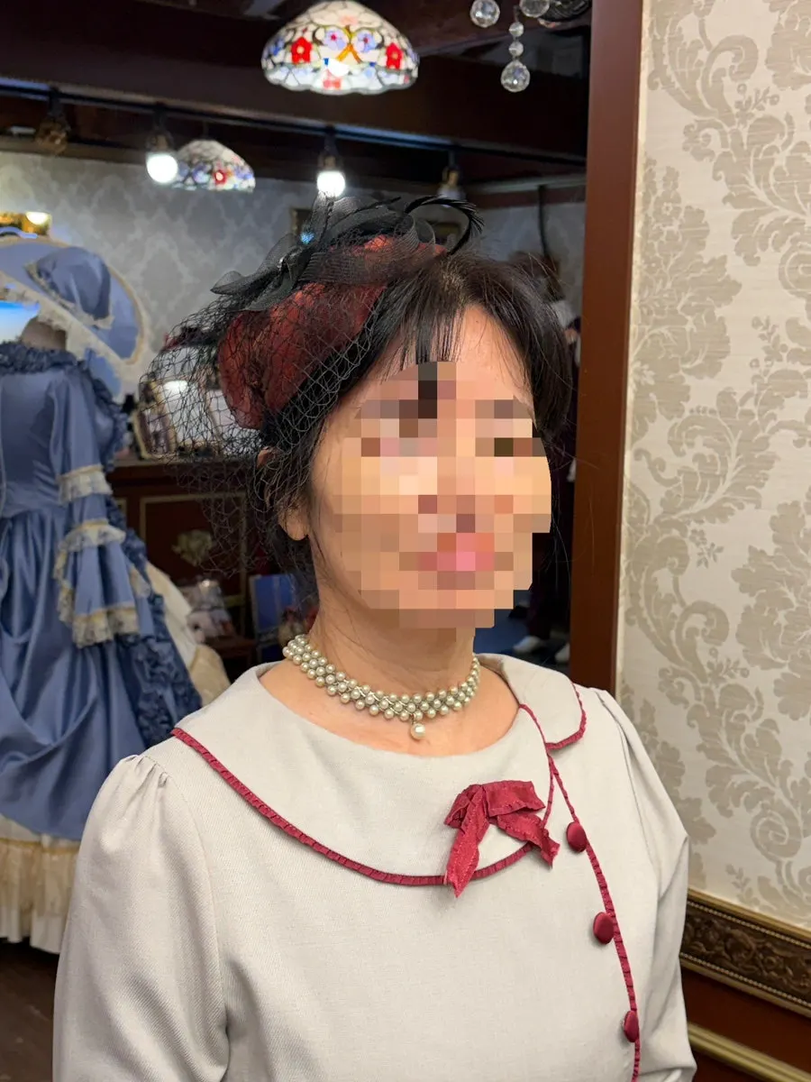 A Gyeongseong costume styled with a belt and other props