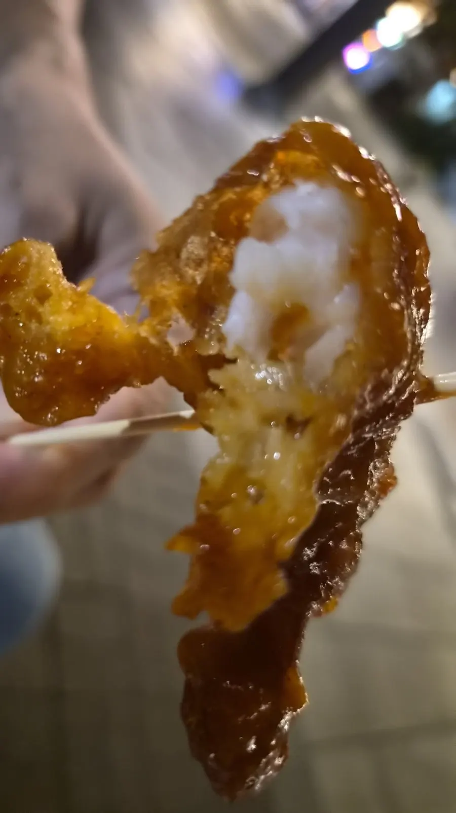 Close-up of shrimp gangjeong coated in sauce