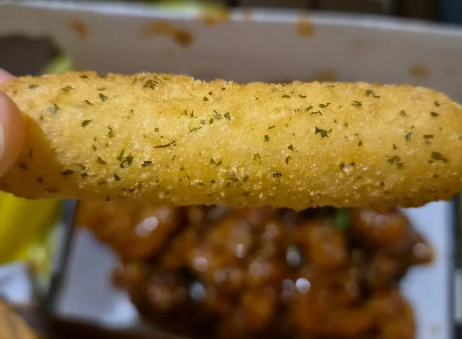 Sweet potato cheese sticks placed alongside the dakgangjeong