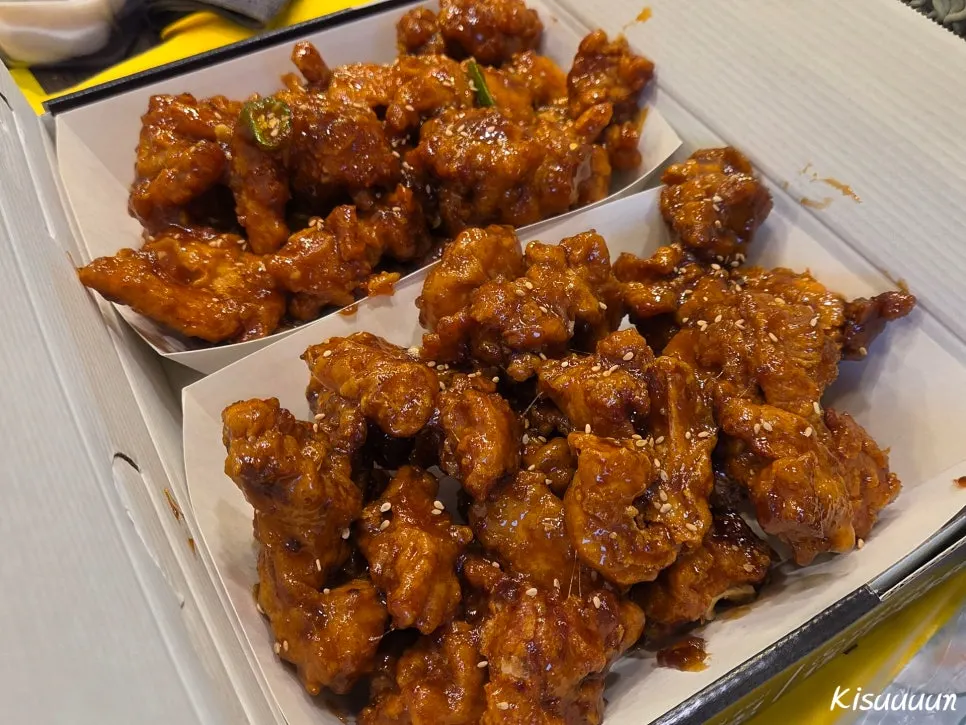 Fried pieces being tossed in sauce