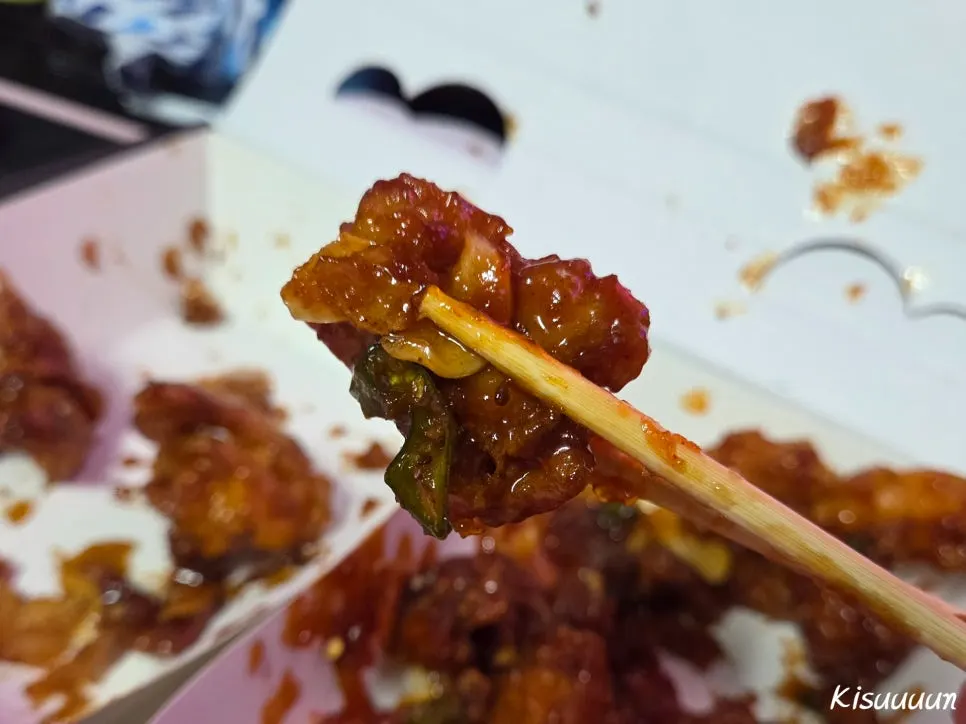 Close-up of dakgangjeong coated in soy sauce