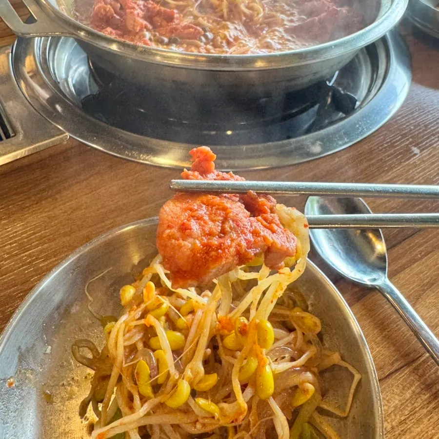 Galbi hot pot with richer broth and side of chives
