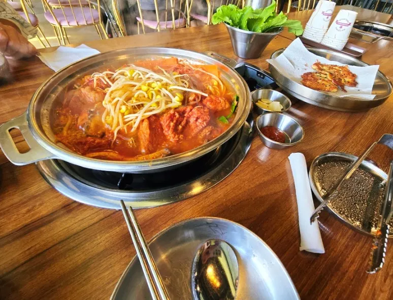 Full table spread with rice and galbi hot pot