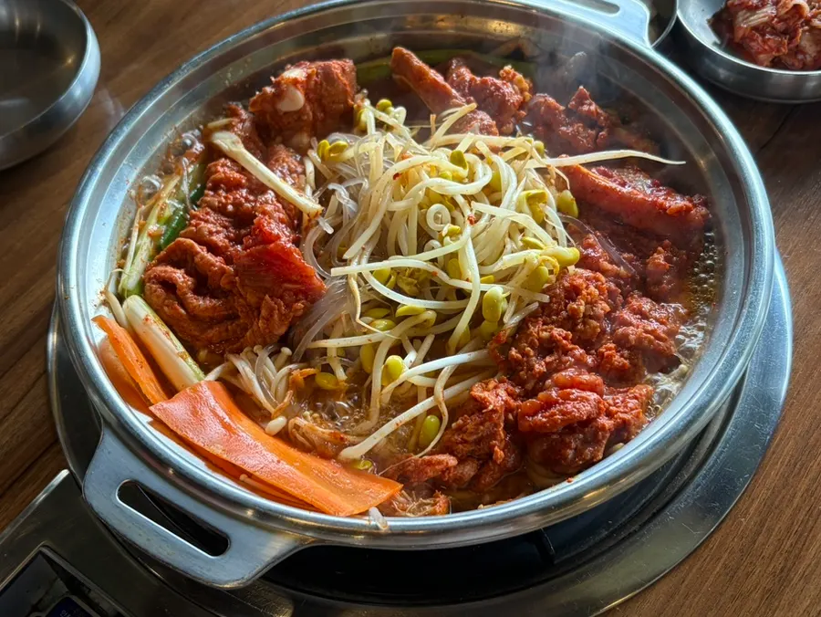 Galbi hot pot piled with bean sprouts and glass noodles