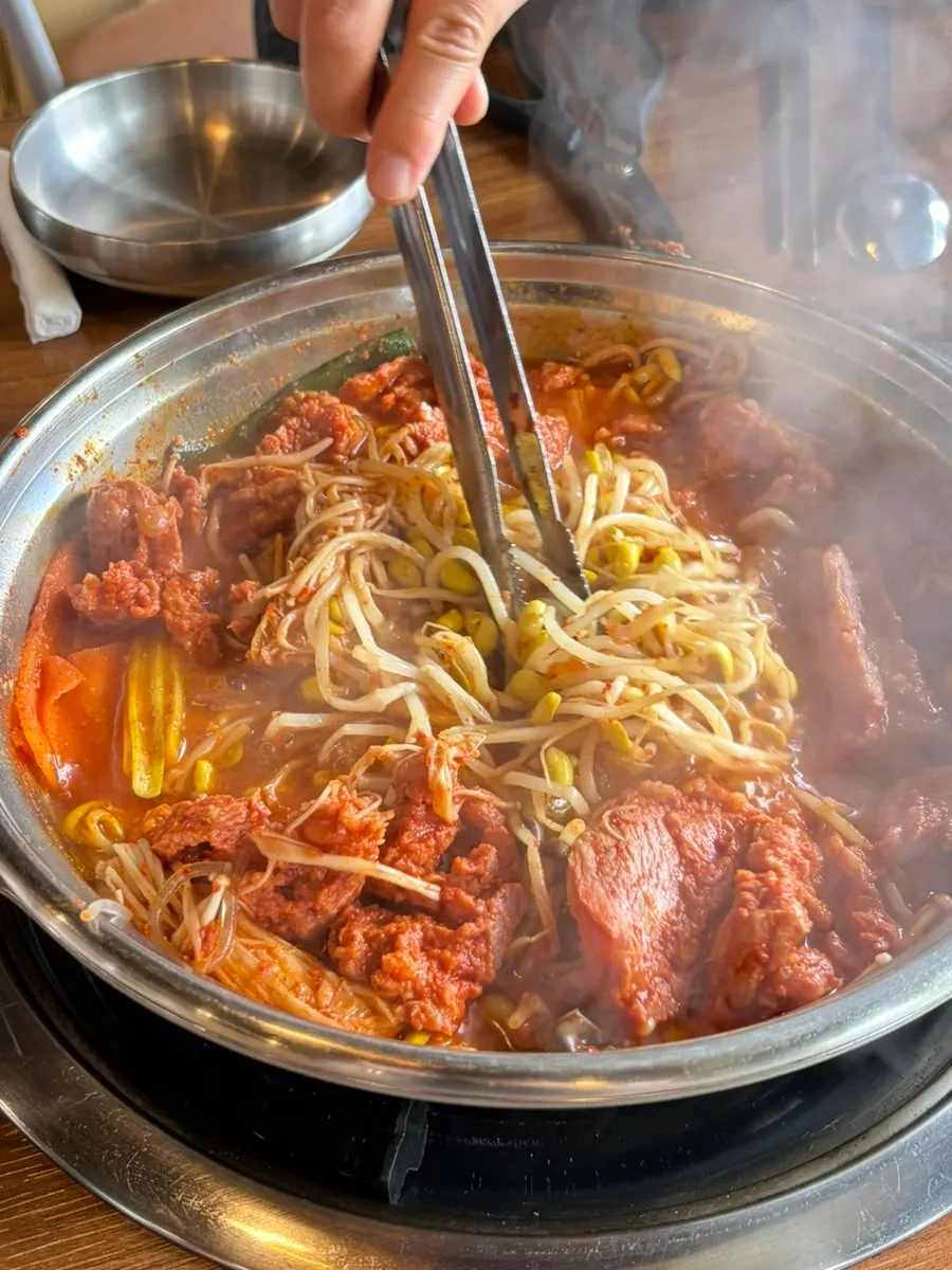 Thick galbi hot pot broth simmering