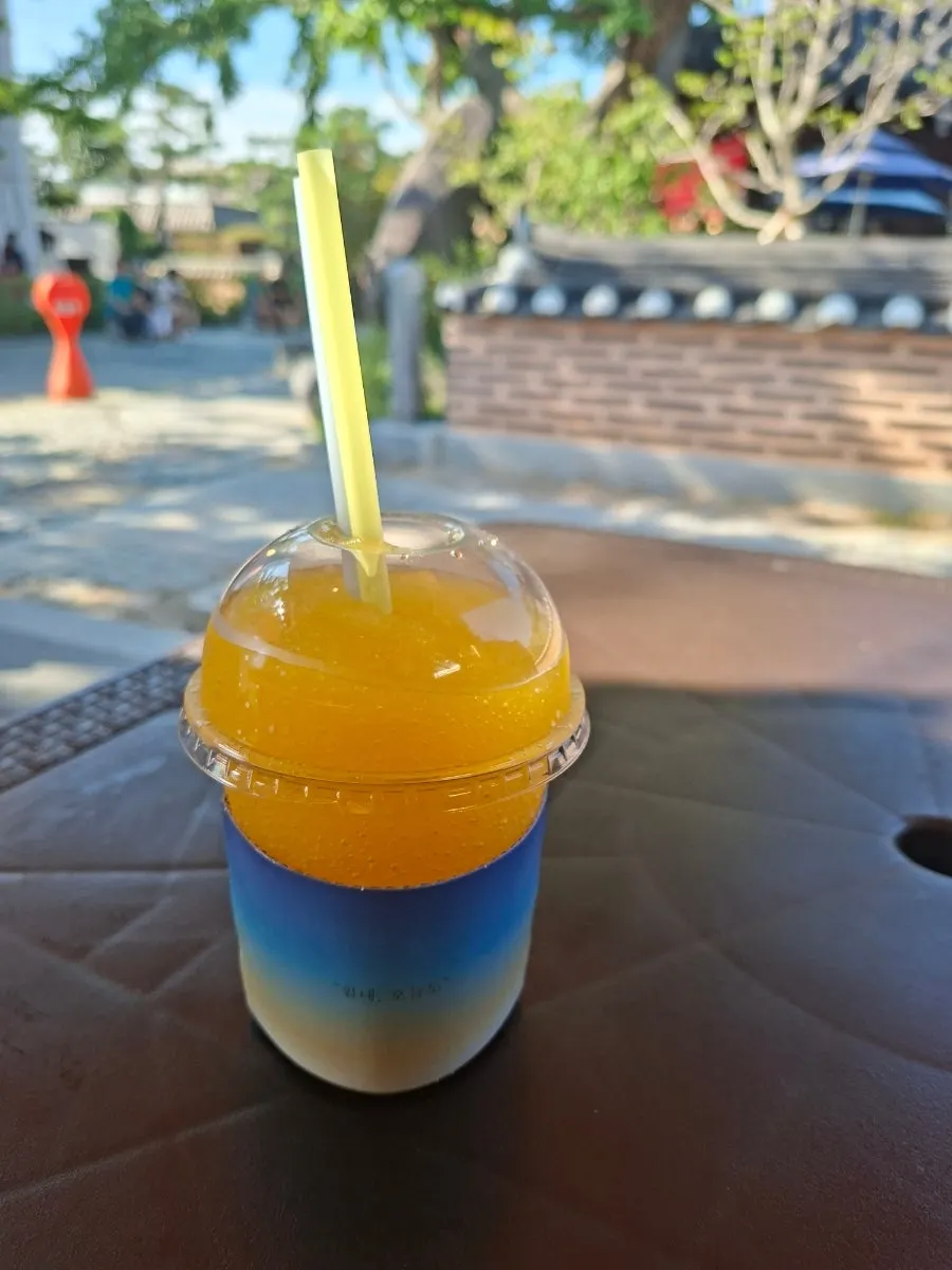 Cup of self-poured mango-flavored slushy