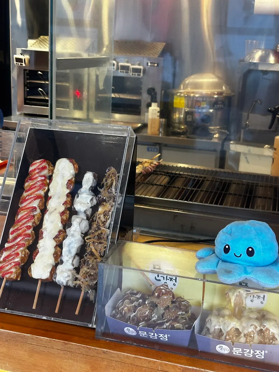 Four flavors of skewers displayed at the entrance