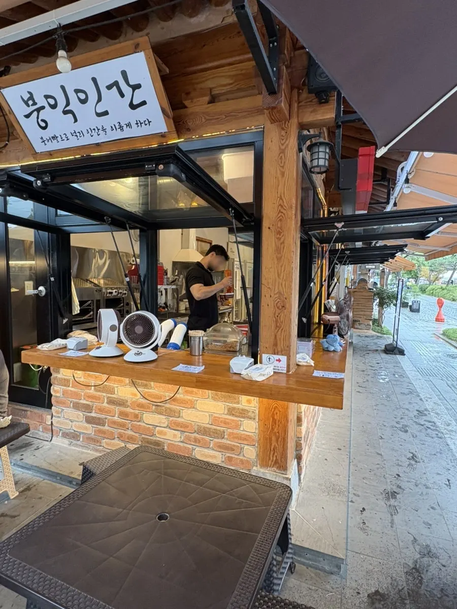 Seating with a hanok wall as the backdrop