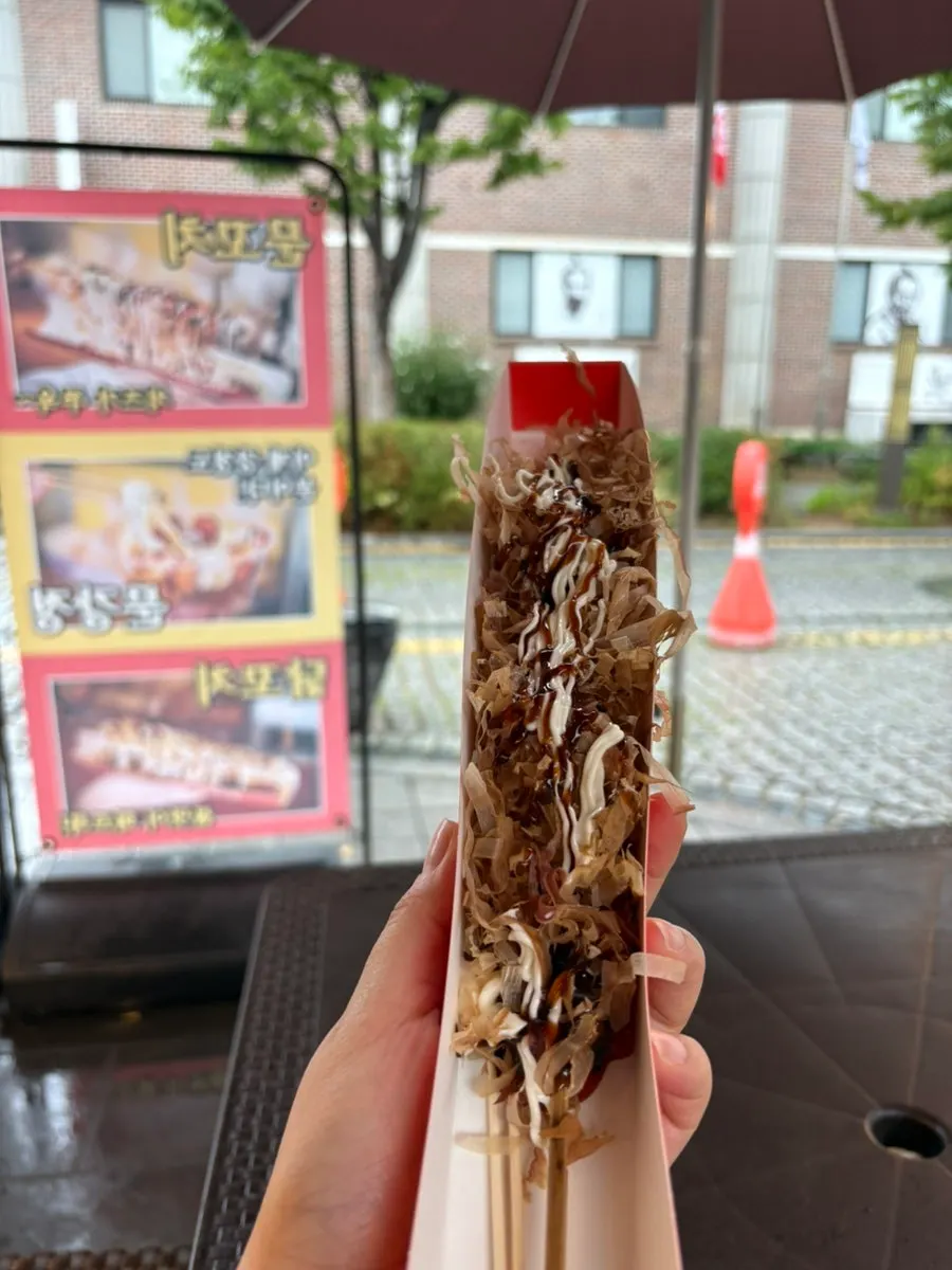Octopus skewer topped with bonito flakes